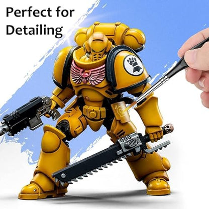 Fuumuui miniature paint brushes being used for precise detailing on a small scale model figure