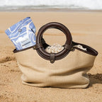 Portable Saalt wipes pack next to a menstrual disc for size comparison.