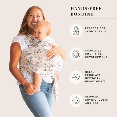 Parent wearing the Moby wrap carrier demonstrating the hands free ergonomic design