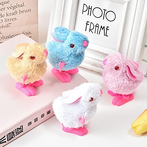Four pieces of mini furry jumping creatures showing the mechanical winding keys.