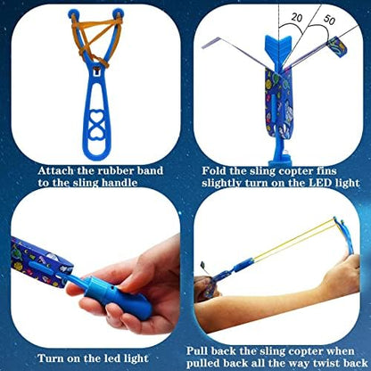 Demonstration of how to fold the plastic wings and hook the JX helicopter onto the rubber band launcher.