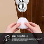 White Eudemon safety door knob guard installed on a standard round door