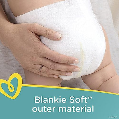 Close up view of the color changing wetness indicator strip on a Pampers Swaddlers active baby diaper.
