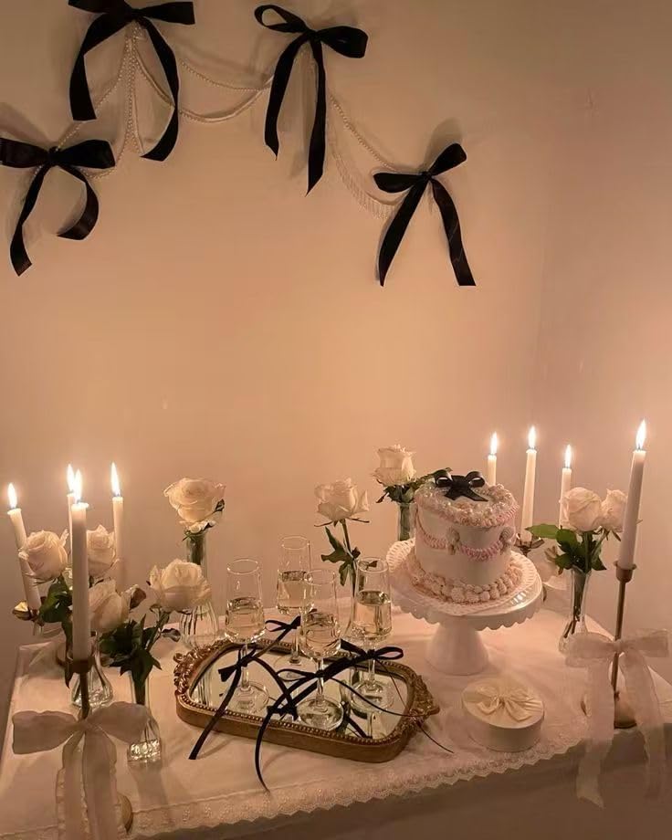 Close up of coquette aesthetic black ribbon bow cake topper