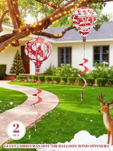 Close up of red and white christmas wind spinner hanging in garden