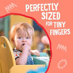 Bite-sized puffed corn and quinoa hoops close up illustrating texture for pincer grip practice.