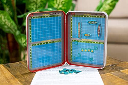 Close-up of the illustrated foam magnets and scoring pieces included in the Battle of the Boats travel set.