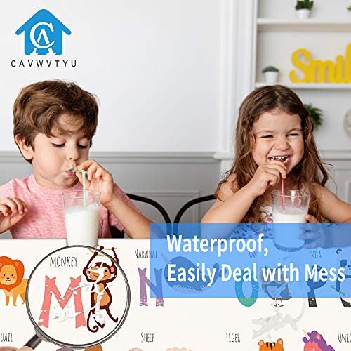 Toddler engaging in messy arts and crafts while sitting on the durable CAVWVTYU weaning mat