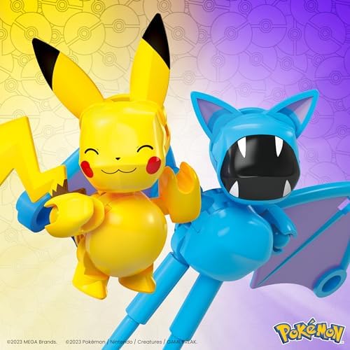 Two functional toy PokÃ© Balls opened up with building pieces inside.