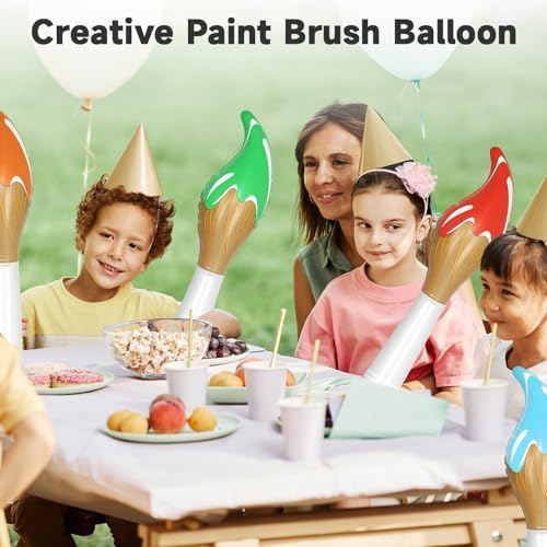 A row of four giant premium quality inflatable paint brushes suspended from a ceiling for an art exhibition theme.