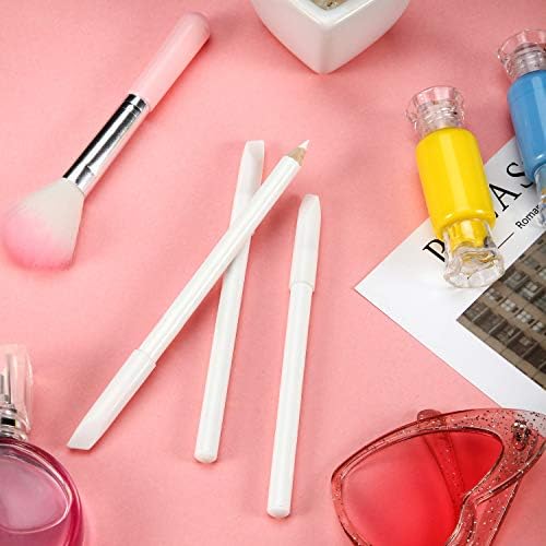 Using the protective cap as a cuticle pusher tool on the fingernail bed.