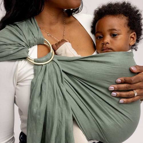 Caregiver utilizing the breathable WildBird Acadian sling as a nursing cover