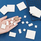 Durable and eco friendly ceramic coral propagation tiles displayed on a grid platform for marine tanks