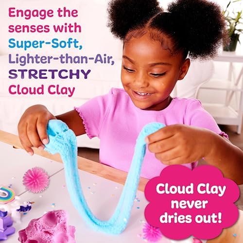 Close up of pink and blue cloud clay with unicorn accessories