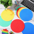 Full eight piece set of Gemscream sensory cushions organized by color for tactile play.