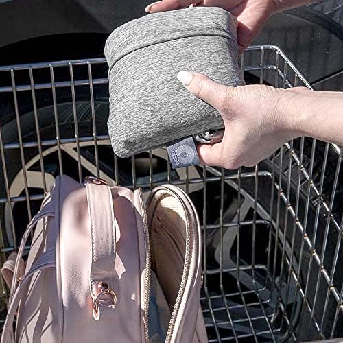 Boppy compact shopping cart seat protector used on a public park playground swing