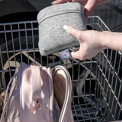 Boppy compact shopping cart seat protector used on a public park playground swing
