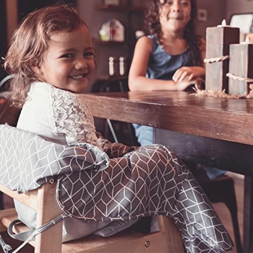 Diono blue geometric print infant seat liner folded into its compact storage pouch.