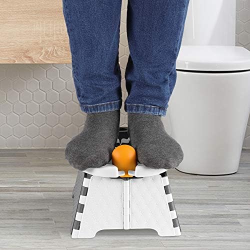 Black YUNHECAM toddler toilet trainer with splash guard installed