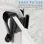 Aquarium air pump tubing neatly organized along the back of a fish tank using plastic clips.