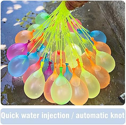 Water filling process showing dozens of vibrant rubber balloons inflating simultaneously from a single outdoor garden hose faucet.