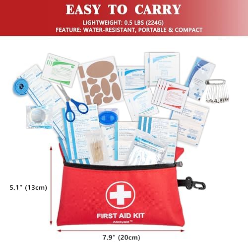 Atickyaid 140 piece medical kit components laid out showing bandages and gauze.