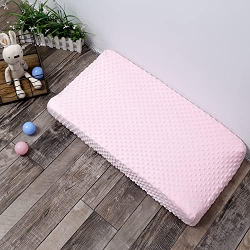 Authentic pink DONOMILO infant mattress sheet folded neatly showing its thick velvet quality.