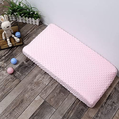Authentic pink DONOMILO infant mattress sheet folded neatly showing its thick velvet quality.