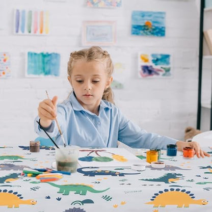CLCROBD toddler splash mat being used as a tablecloth for arts and crafts