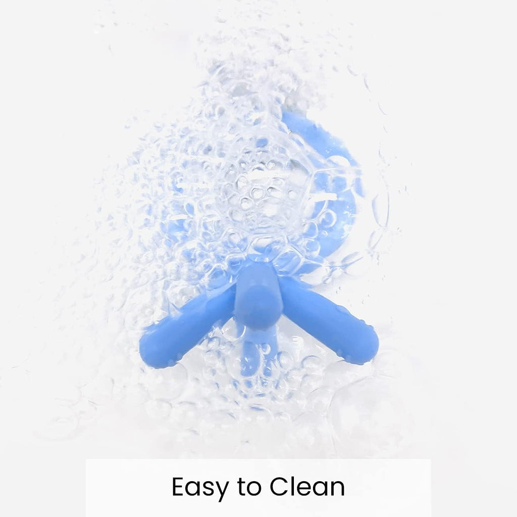 Comotomo blue baby teether highlighting the soft flexible texture for gum relief