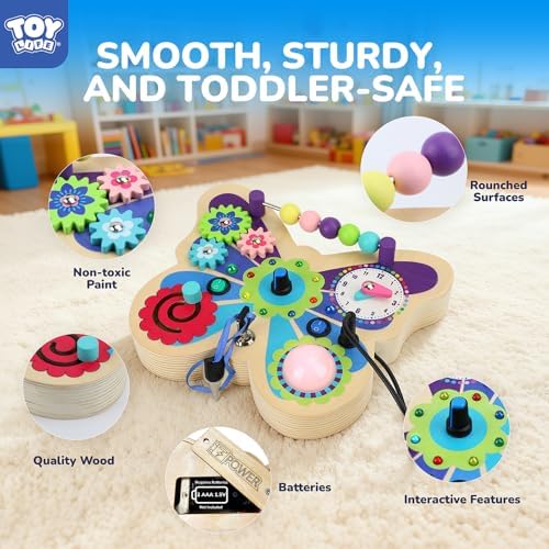 Toddler hand pressing a button on the TOY Life sensory board demonstrating fine motor skill development.
