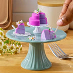 Collection of various replica dishes and recipe cards from the Series 2 assortment.