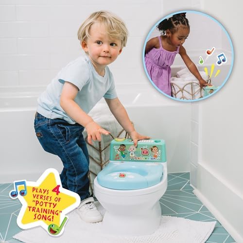 Removable pieces of the green and yellow musical potty trainer disassembled for cleaning