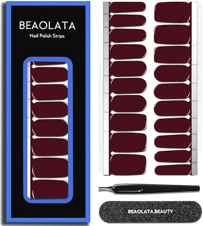 Close up view of the twenty pieces of glossy deep red gel nail sticker wraps in various sizes