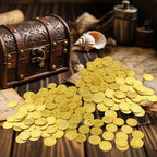 Premium gold-colored plastic reward tokens scattered as adventure themed event supplies and table confetti