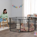 Regalo black metal adjustable baby gate folded flat illustrating its convenient compact storage capabilities.