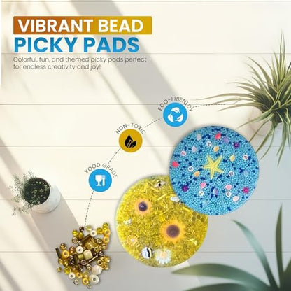 Silicone sensory pick pad with embedded yellow bee charms for anxiety relief.