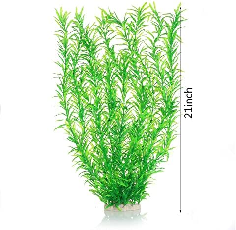 Two pieces of twenty one inch green plastic aquarium foliage standing upright.