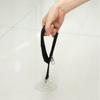 Black pet bathing tether for small dogs and cats in a tub