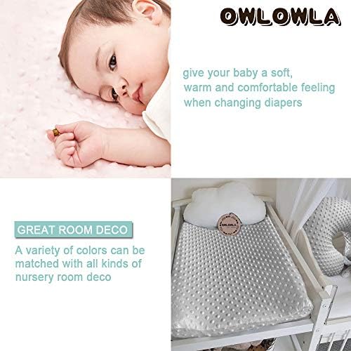 Close up view of the textured plush dots on the baby changing sheet