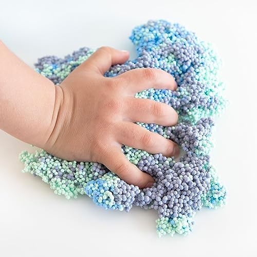 Adult hands squeezing the reusable tactile modeling foam as a calming stress relief fidget tool.