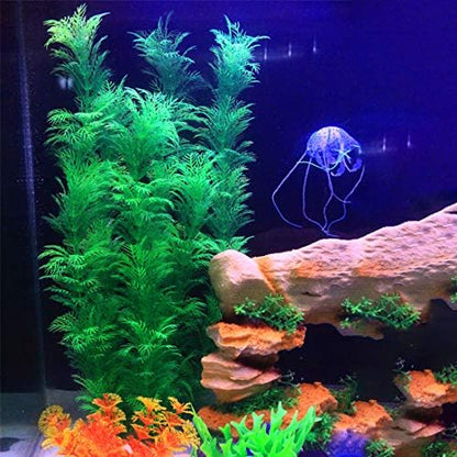 Hamiledyi plastic aquarium decorations installed inside a large fish tank.
