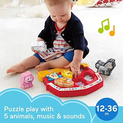 Toddler shape sorting toy with chunky plastic animal figures being inserted into matching slots.