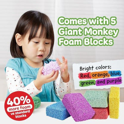 Child hands squishing and molding non toxic bead based monkey foam toy