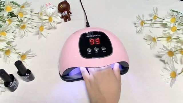 Packaging and included adapter for Bigbear UV LED nail lamp