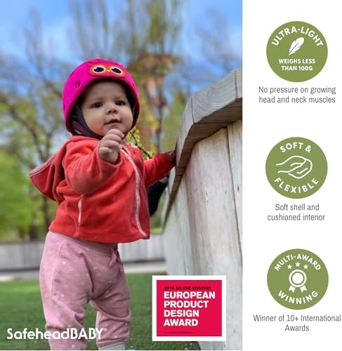 Toddler wearing SafeheadBABY blue sports pattern helmet while learning to walk