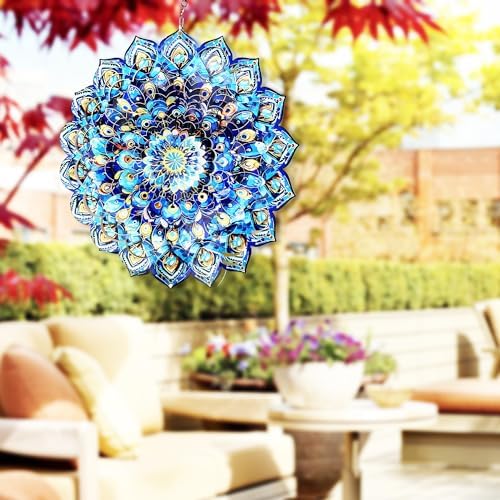 Stainless steel peacock wind spinner hanging in a home interior setting