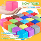Assorted bright purple orange blue and green sensory squeeze cubes piled next to their clear plastic storage container