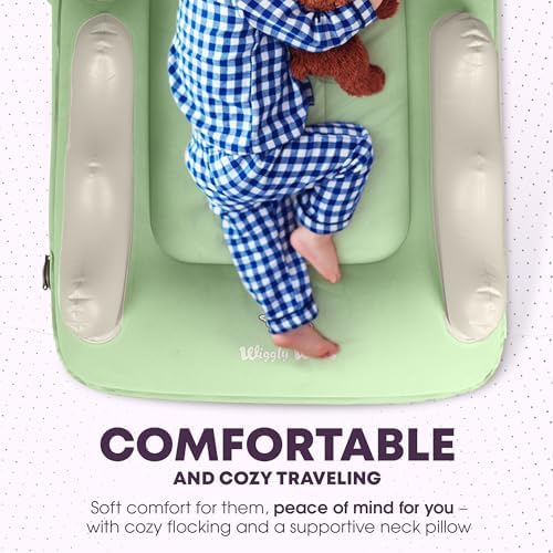 Sage green toddler airplane bed being inflated with the manual fast pump