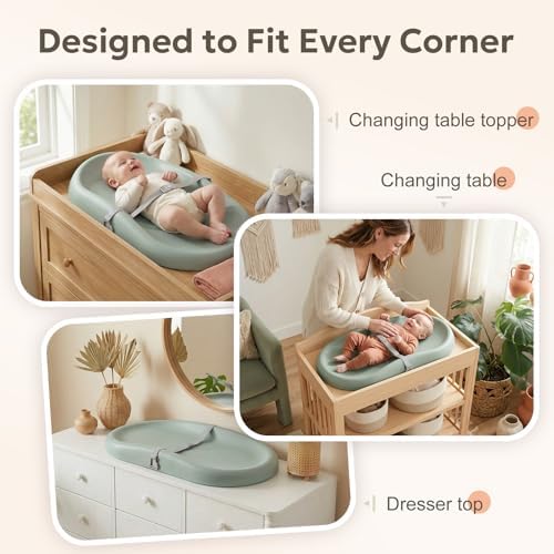 Lightweight green baby diaper mat positioned flat on a wooden nursery dresser top.